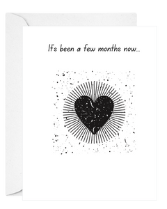 Greeting card with black heart & text 'It's been a few months now...' on white background. Sympathy after time-Deathday Cards