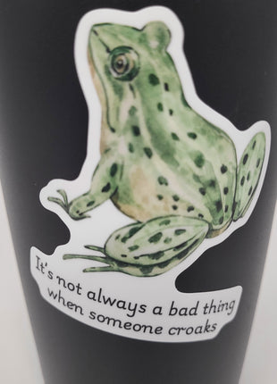 Close up shot of high quality vinyl sticker from Deathday Cards: "It's not always a bad thing when someone croaks"