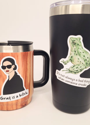 Picture of two mugs with stickers about death and grief- by Deathday Cards